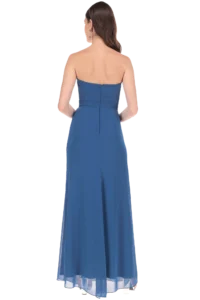 Back view of a woman in a blue strapless evening gown with a visible zipper at the back.