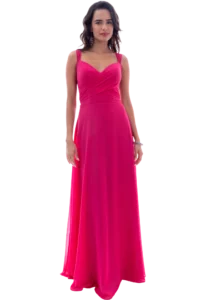 Full-length view of a woman in a bright pink evening gown standing against a black background.