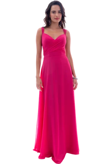Full-length view of a woman in a bright pink evening gown standing against a black background.