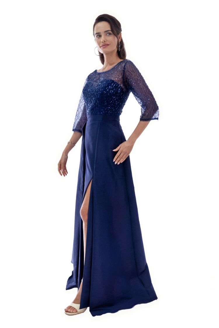 Vestido largo escote ojal con transparecia manga 3/4´s con falda con pliegue y sobrefalda