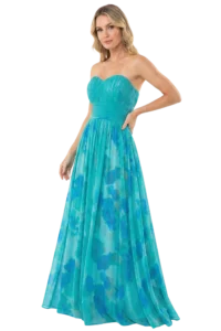 Woman in a turquoise strapless pleated evening gown with a waist sash, standing with one hand on her hip against a black background.
