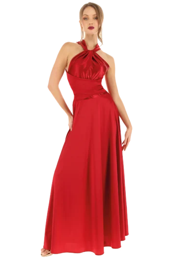 Full-length red halter-neck evening gown on a model, standing with hands on hips against a black studio background.