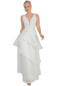 Bride wearing a sleeveless white wedding gown with a lace bodice and tiered, cascading ruffled skirt.
