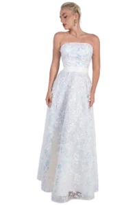 Woman in a strapless white floral-embellished gown, looking to her left, wearing gold earrings with a pearl drop.