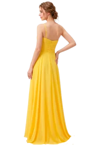 Woman in a bright yellow gown viewed from the back, standing with one hand on her hip.