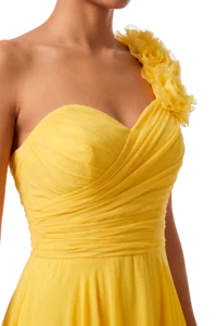 Yellow strapless dress with a ruched bodice and a large fabric flower across the shoulder.