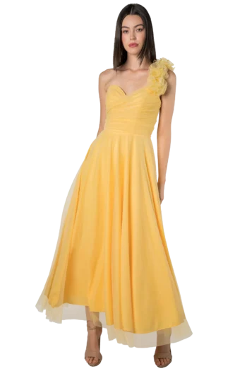 Woman in a yellow one-shoulder evening gown with a ruffled shoulder and flowing skirt.