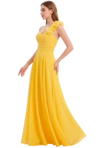 Profile of a woman wearing a bright yellow, one-shoulder gown with a large floral shoulder embellishment against a black background.