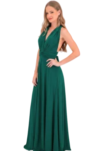 Full-length photo of a woman in a green evening gown posing with one hand on her hip against a black background.