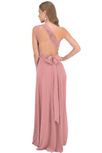 Back view of a dusty-rose evening gown with open back, crisscross straps, and a tied bow at the waist.