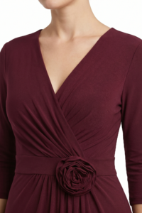 Maroon wrap dress with a fabric rose belt at the waist, shown from the shoulders to mid-tem