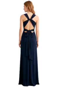 Back view of a woman in a navy blue evening gown with crisscross straps tied into a bow at the lower back to create an open-back design.