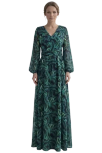 Woman in a floor-length dark-green tropical-print dress standing against a black background.