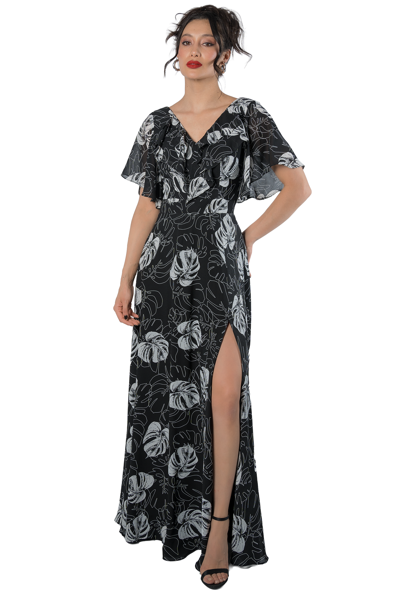 Vestido largo negro con estampado tropical de hojas blancas, escote en V y mangas tipo olán, modelo Massima colección otoño-invierno, vista frontal