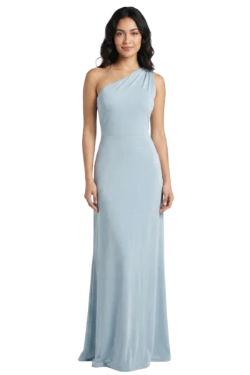 Woman wearing a pale blue one-shoulder evening gown, standing against a black background.