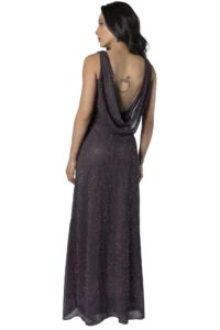 Woman seen from behind wearing a dark purple, draped, backless evening gown with a dotted pattern and a circular tattoo on her upper back.