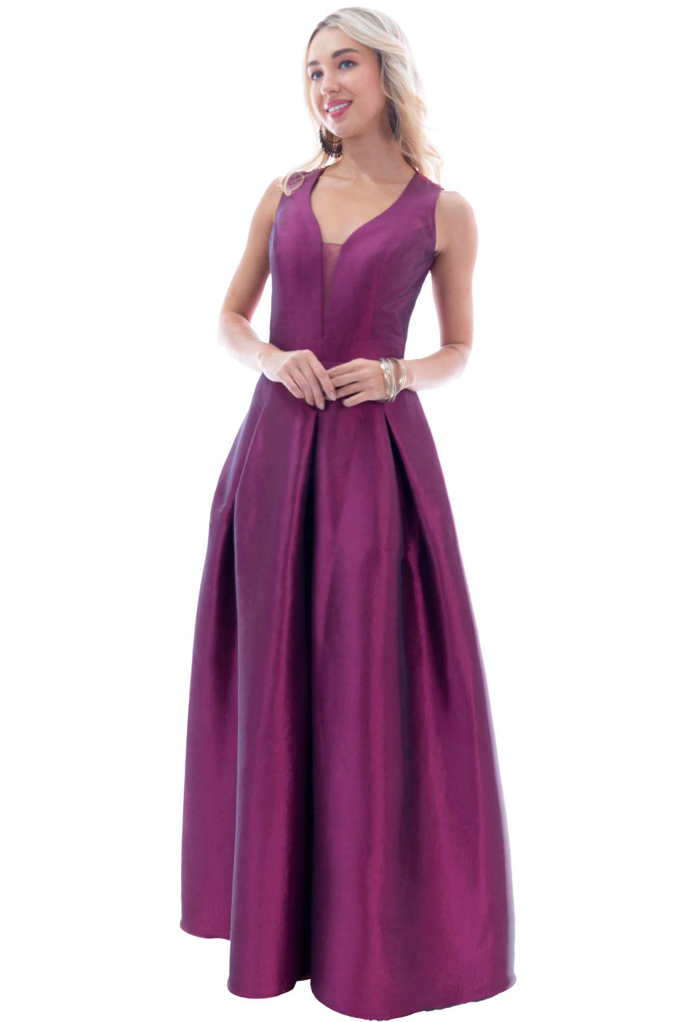 Full-length image of a woman in a magenta gown, standing with hands loosely clasped and smiling at the camera.
