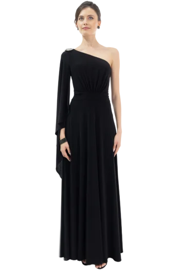 Woman in a long black one-shoulder evening gown with a gathered waist and jeweled shoulder detail, standing against a neutral backdrop