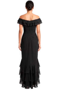 Woman wearing a black off-the-shoulder gown with multiple layered ruffles seen from the back, hair in a bun.
