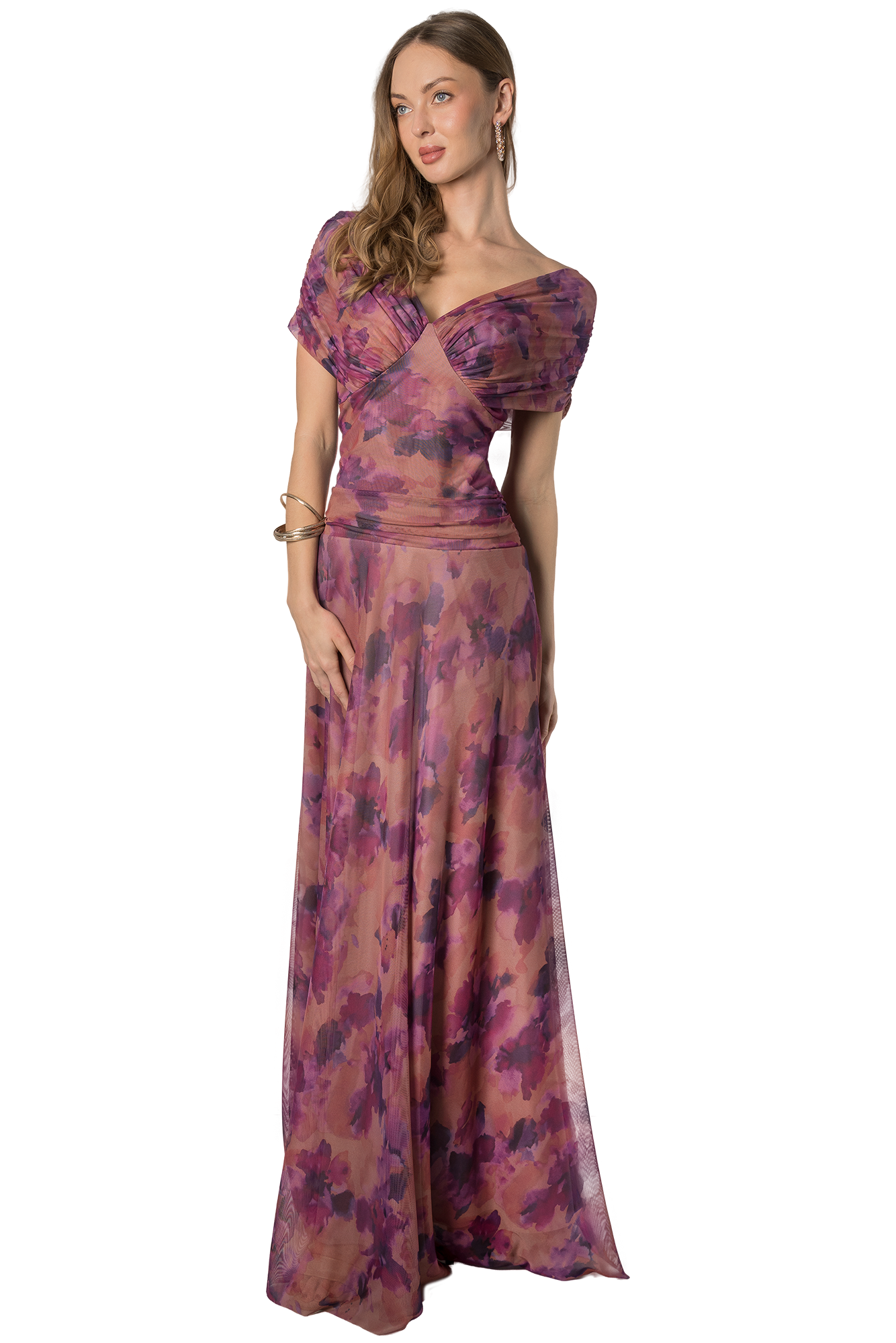 Woman in a long pink and purple floral gown with off-the-shoulder neckline posing solo against a plain background.